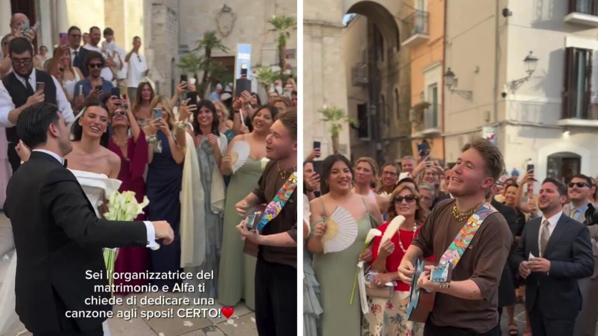 Bari Vecchia, Alfa a passeggio tra i vicoli: nota una coppia di novelli sposi e canta per loro – VIDEO