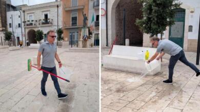 Residui di cibo, lattine e sporcizia dopo la serata in piazza: a Cellamare il sindaco la pulisce